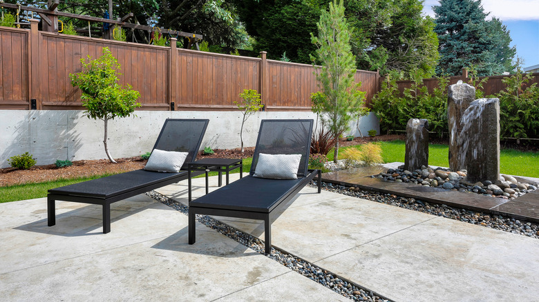 styled concrete patio with rocks