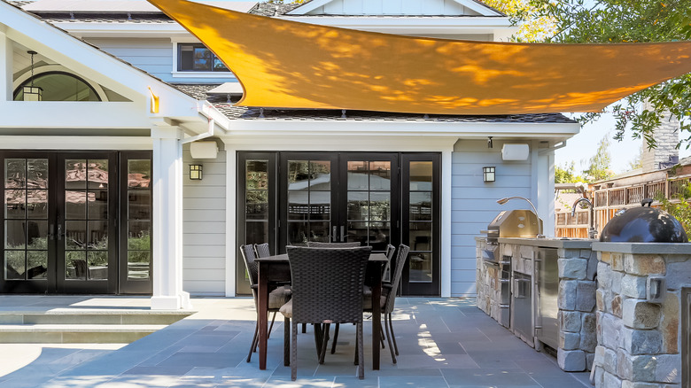 smooth patio with table and grill