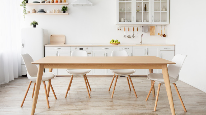 wooden table in white kitchen