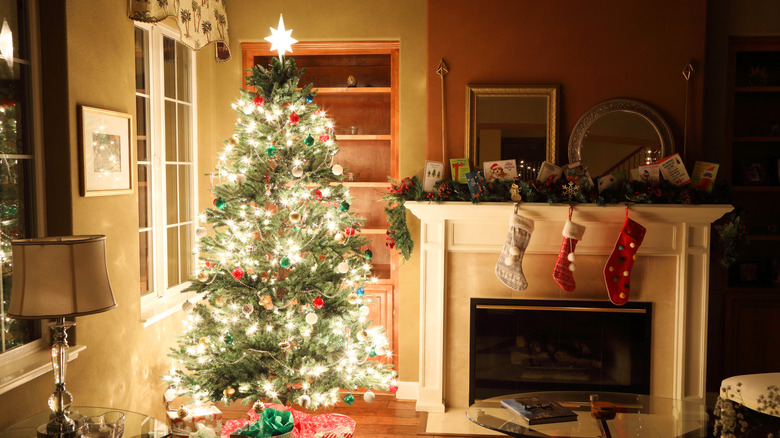 A brightly lit Christmas tree in a living room