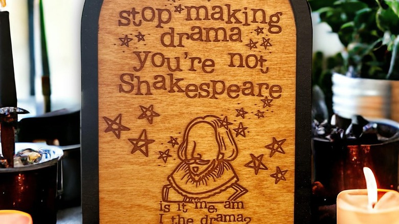 A decorative sign showcasing Shakespeare with funny text around him