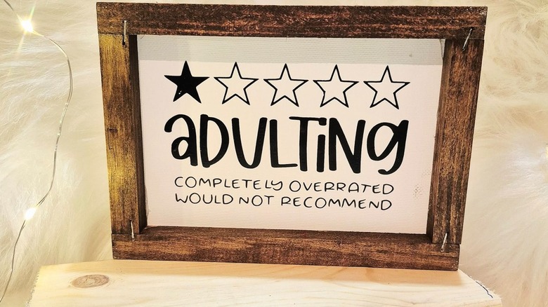 A sign giving one star to adulting