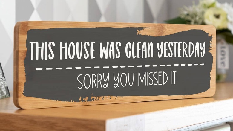 A sign declaring the house isn't clean today