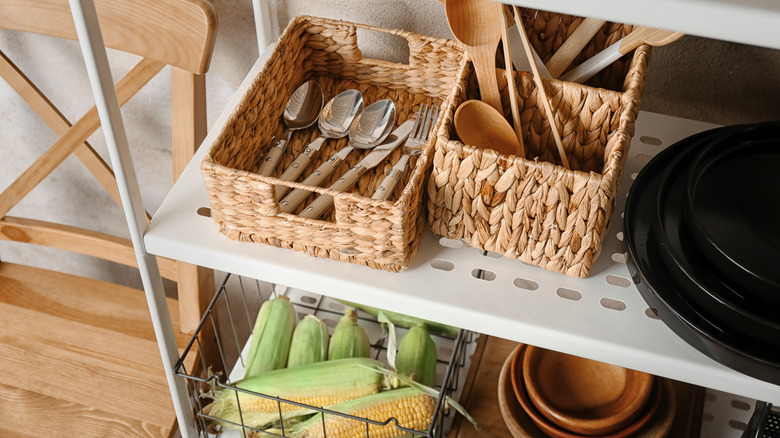 Utensils in baskets on storage stand