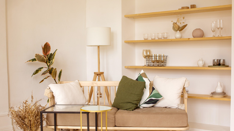 Shelves wtih groupings of glasses and other knick-knacks.
