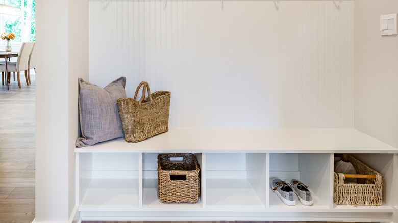Utility baskets used in cubbies in a mudroom.