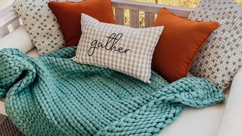 Cushioned porch swing