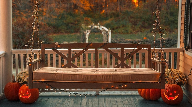 String light wrapped porch swing
