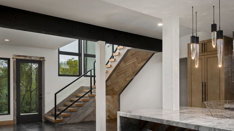 black beam across white ceiling
