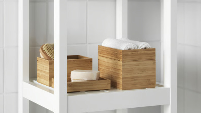 IKEA DRAGAN 4-piece bathroom set on white shelves