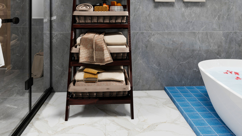 Organized bathroom with gray tile