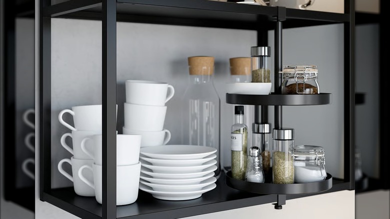 ENHET black steel swivel shelf holding condiments in kitchen shelf unit