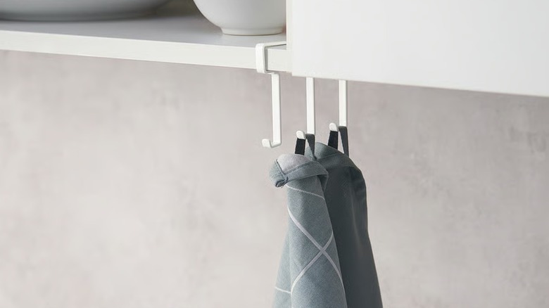 PÅLYCKE metal clip-on hook rack hung on kitchen cabinet shelf