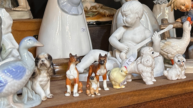 A collection of ceramic animals on a table.