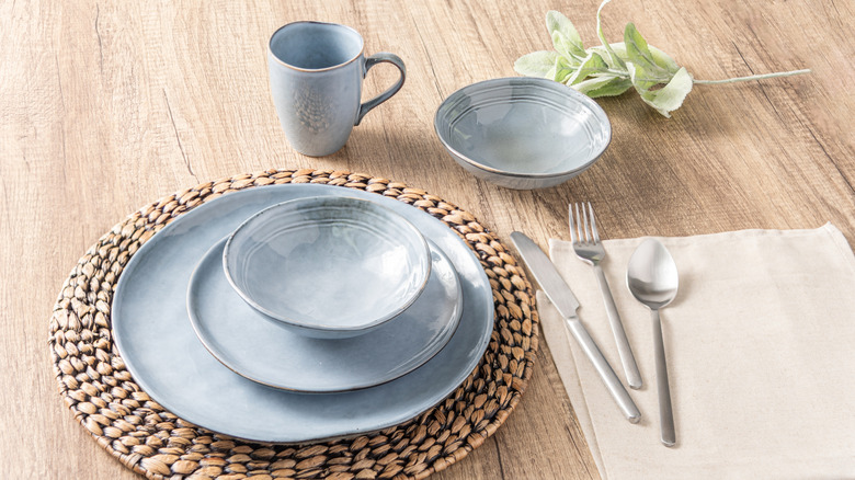Light blue stoneware dishes on a table.
