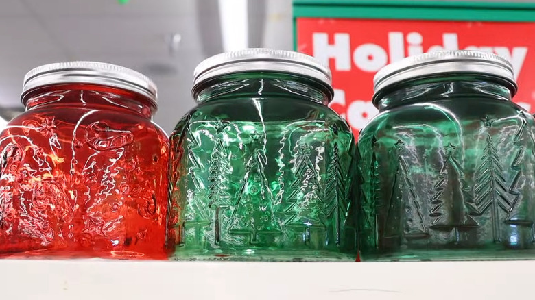 Red and green embossed jars in a Dollar Tree store.