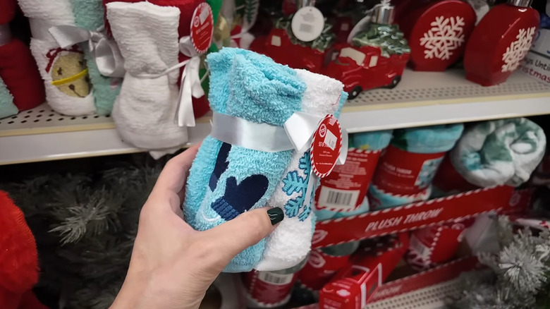 The blue and white holiday themed wash cloths in a Dollar Tree store.