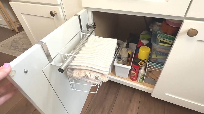 DIY over-the-door rack with folded kitchen towels