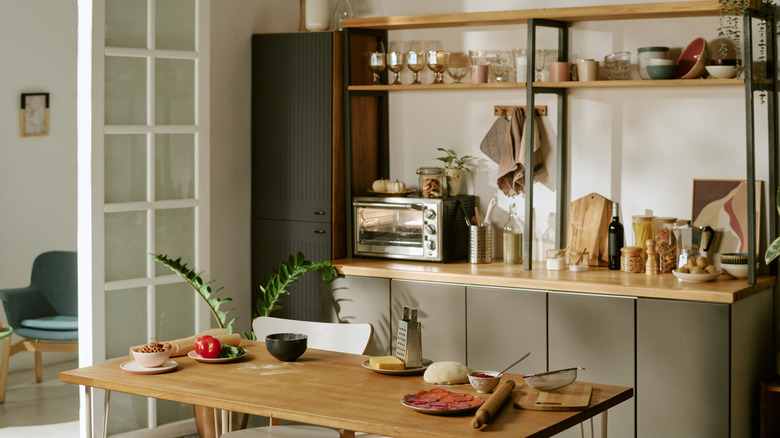 Kitchen with a wood table and various kitchen items