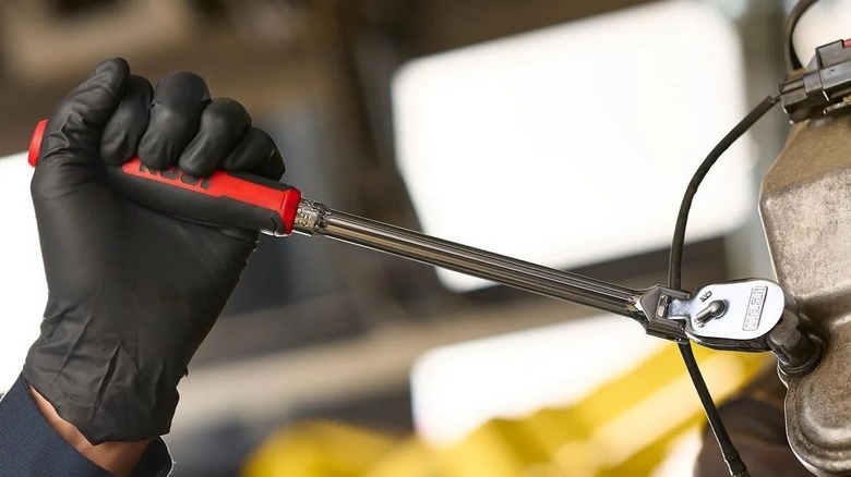 Gloved hand using a flex ratchet