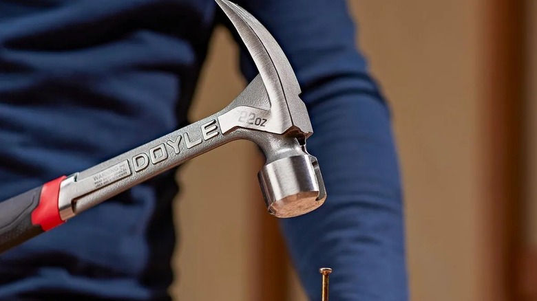Person using a Doyle framing hammer