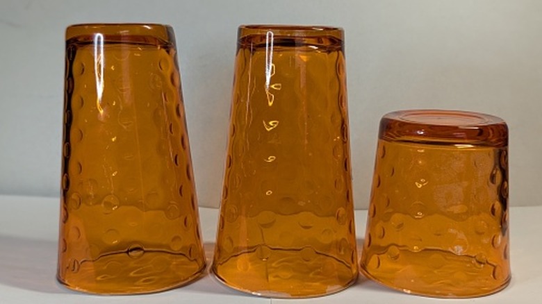 Amber glass vintage tumblers with indents in the glass.
