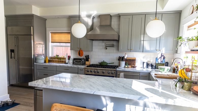 Kitchen with two globe pendant lights over an island