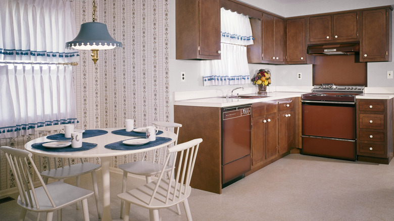 Classic open-plan kitchen and dining room from the 1970s.