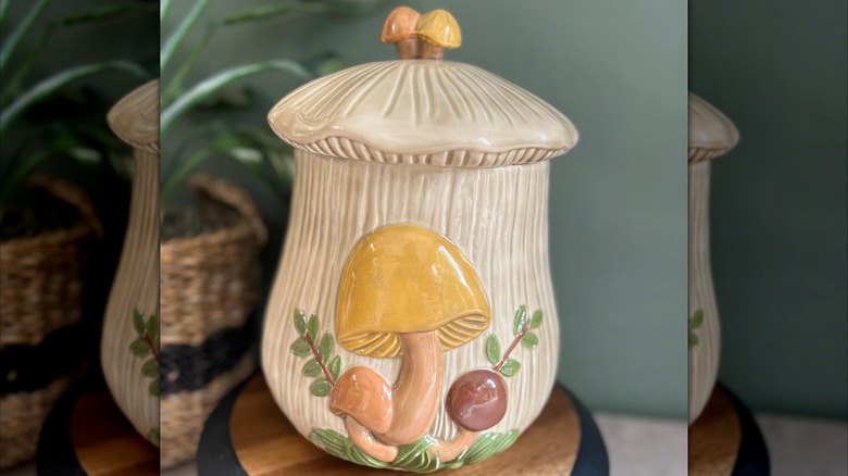 Closeup of a mushroom motif teapot with pumpkins