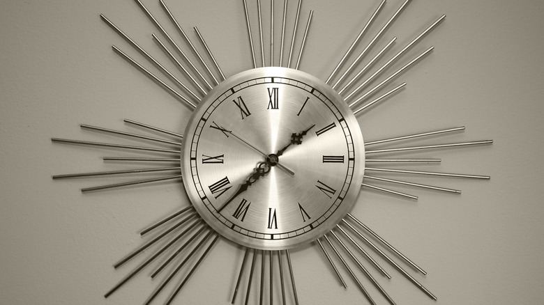 A metal starburst wall clock.