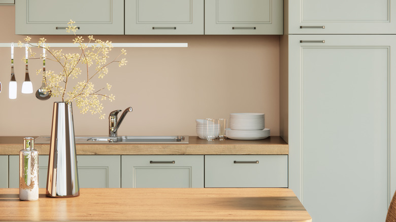 Light green kitchen cabinetry