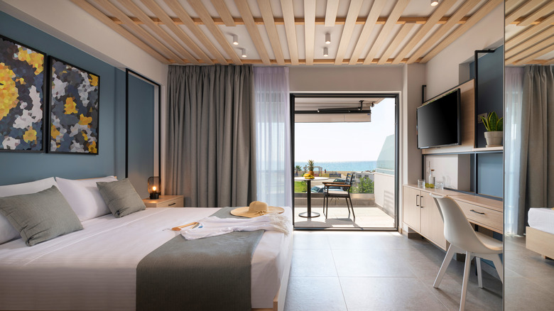 Coastal bedroom with plank ceiling