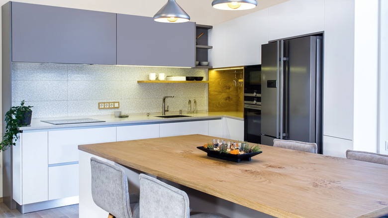 Purple cabinets with oak countertop