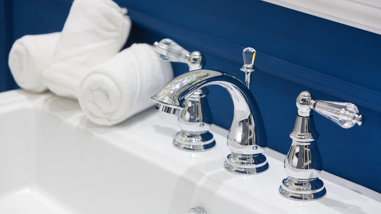 Navy blue wall bathroom sink