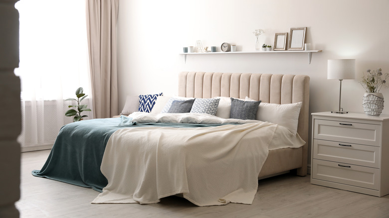 White shelf over the bed