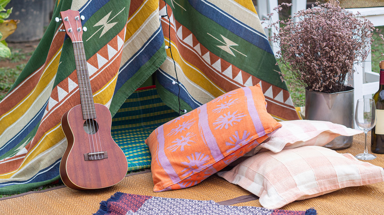 Ukulele and colorful pillows
