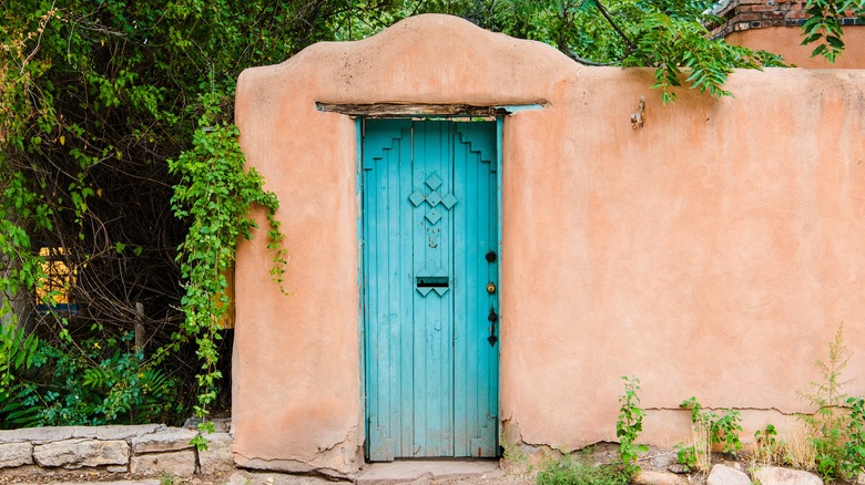 Blue door on stucco wall