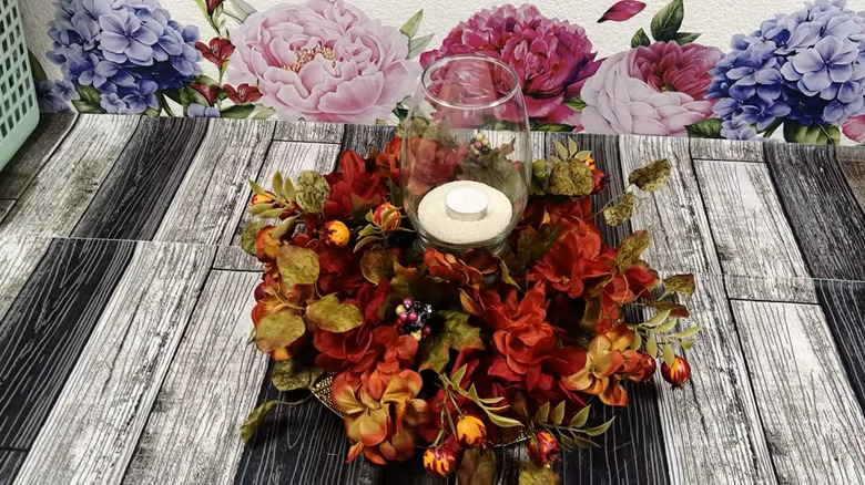 Floral centerpiece with tea light candle in center