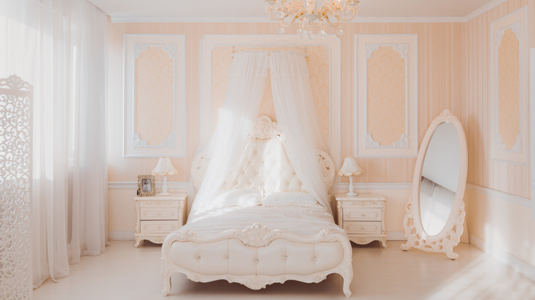 fancy bed in pink bedroom