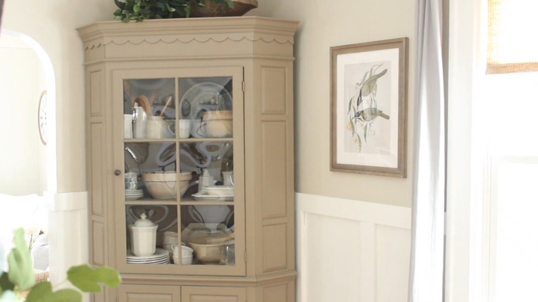 corner cabinets can be upcycled with a fresh coat of paint to offer luxurious storage space in your dining room