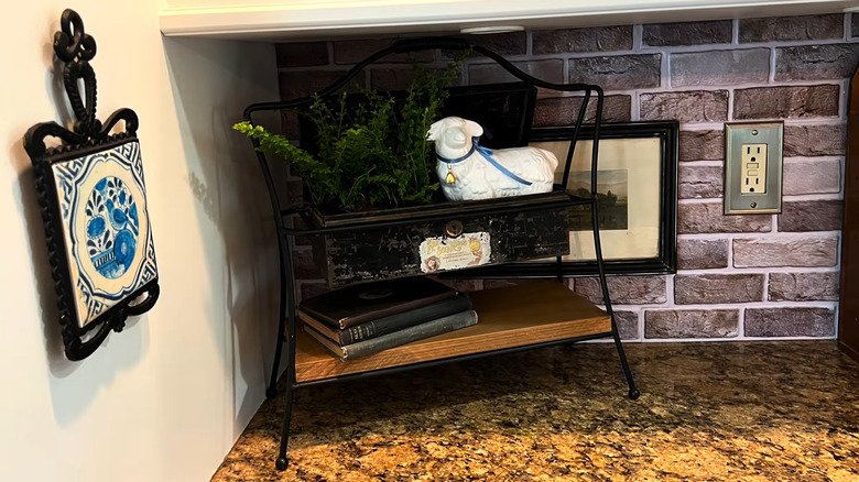 an old two-tier wire shelf and a cash box become a unique corner shelf