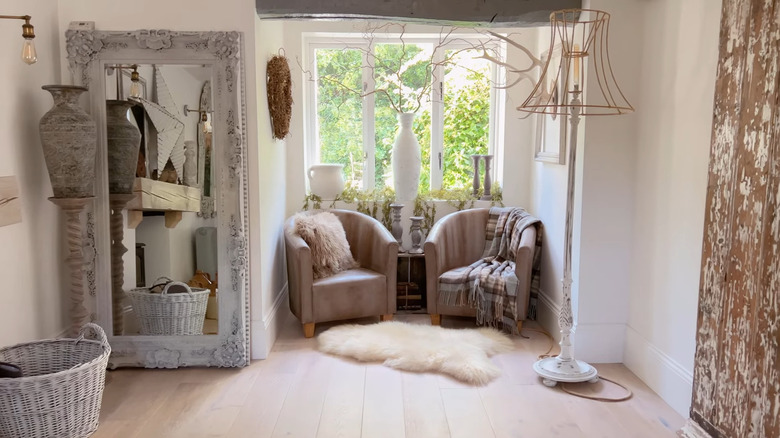 upcycled comfy chairs in a corner alcove create a cozy seating area