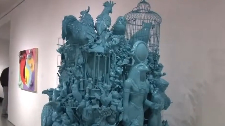 art sculpture made from thrift store finds on display in a gallery