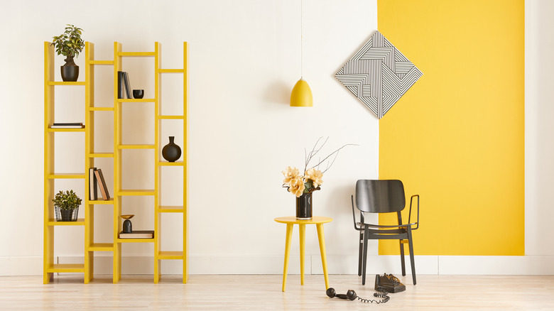 Yellow bookshelf with few items