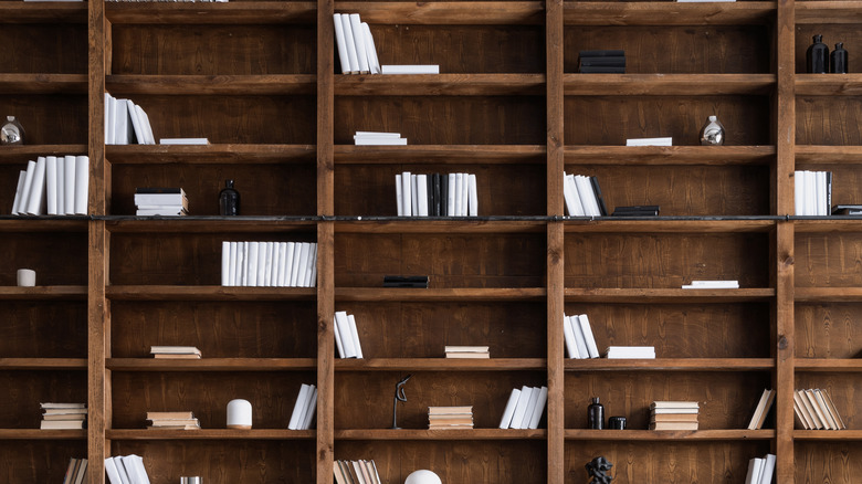 wooden bookshelf with some empty space