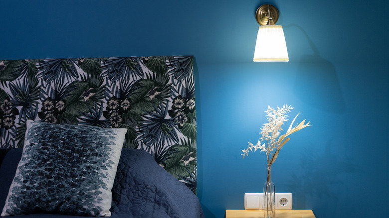 Tropical headboard and blue walls