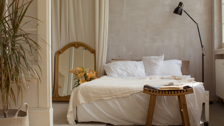 bedroom with black floor lamp