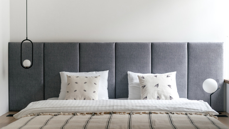 Bed with hanging light pendant