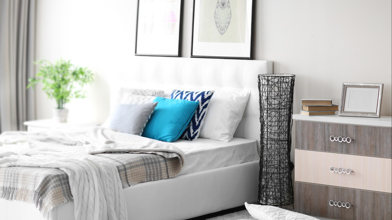 Bed with decorative floor lamp