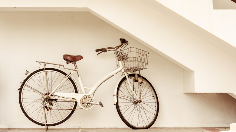 bicycle packed under stairs